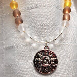 No762 Beautiful handmade long necklace with silver sun and moon pendant